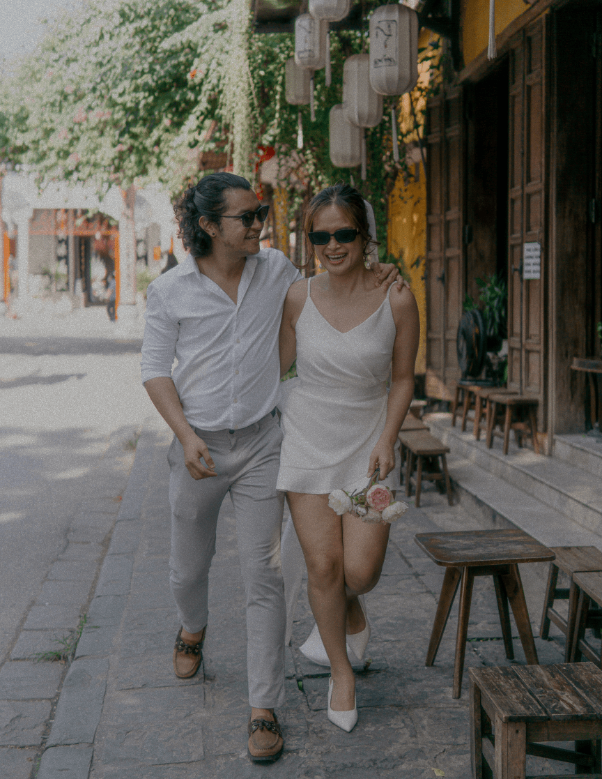 Matt and Ella laughing while walking